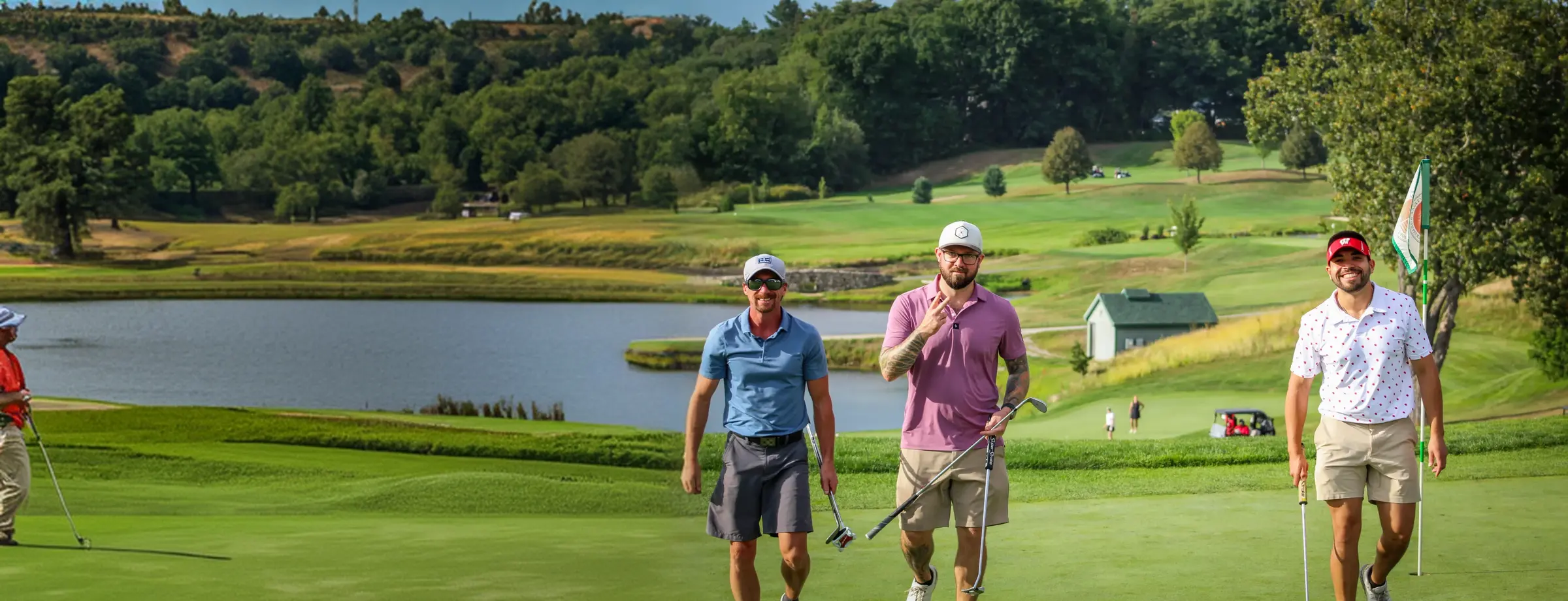 Three members walking off the green