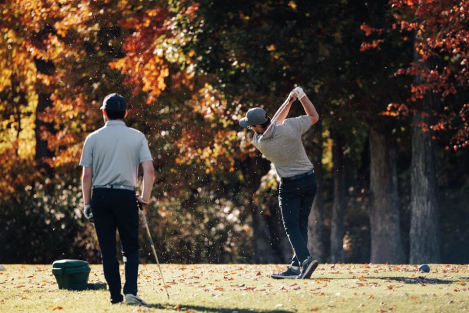 Fall golf swing with autumn foliage