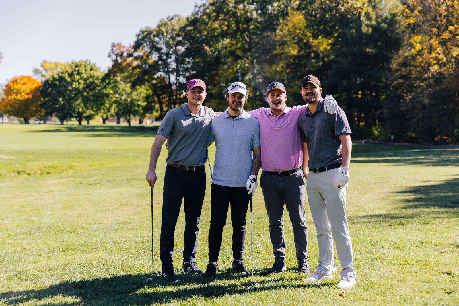 Golfer teeing off on a scenic course